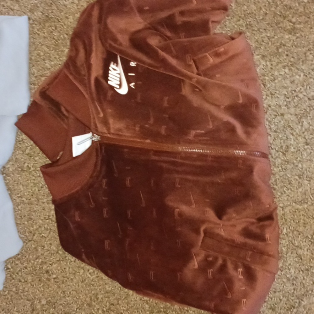 Pink sweaters and one nike sweater
